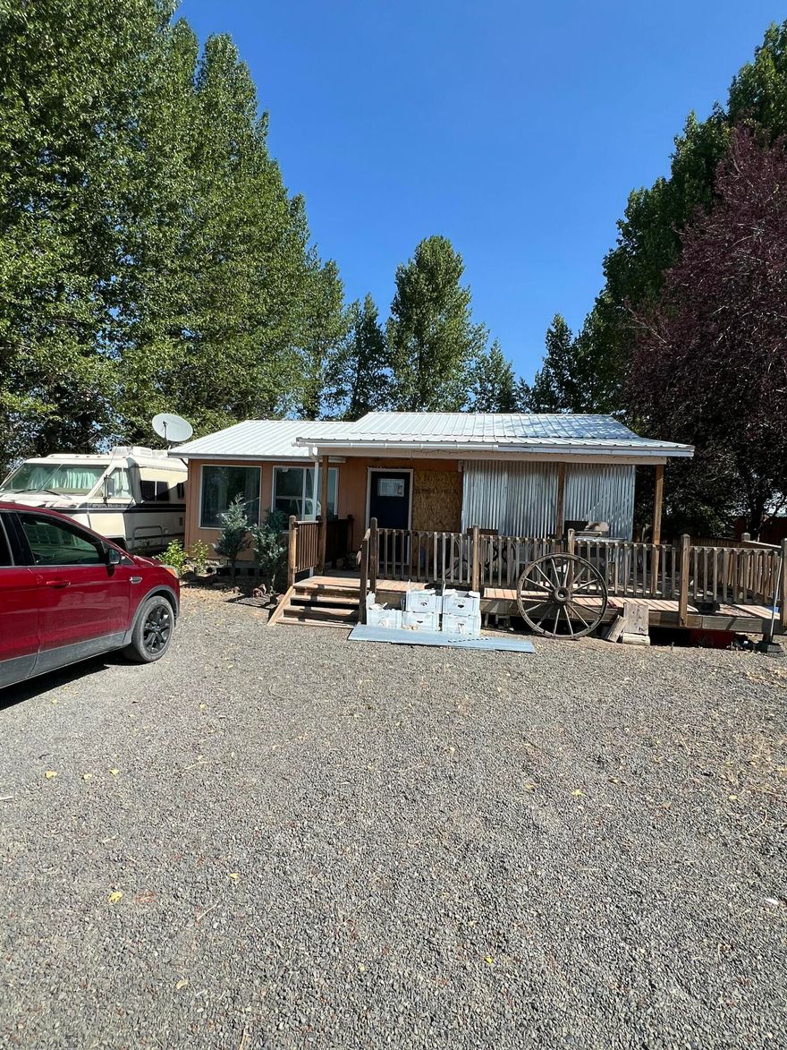 2-Bedroom home located in the heart of Christmas Valley. Surrounded by mature trees along the perimeter, the property provides a peaceful, secluded feel. Enjoy outdoor living with a spacious wrap-around covered porch. A handy storage shed adds extra functionality. Located adjacent to a large park and just steps from local amenities including a gas station and restaurant. The home features city water and a private septic system.