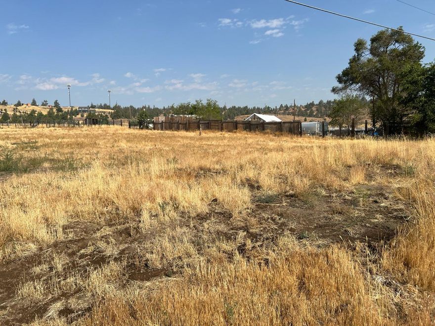 Buildable one acre lot outside of Madras city limits zoned RR5. Property was the home site of a single wide manufactured home that has since been removed. Water, power and on-site septic available. Buyer to do due diligence on the existing on-site septic system. Property has been cleaned up and is ready for your home to be built.