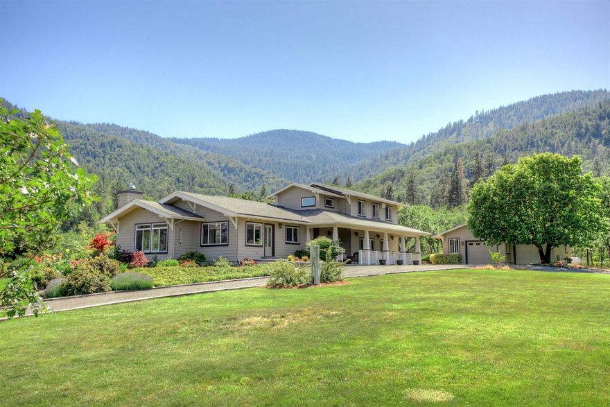 Impeccably maintained, custom estate on 10.43 acres in an area of higher-end homes w/breathtaking, panoramic views of the surrounding countryside and Emigrant Lake. Enjoy your own private Shangri-La, just 2.8 miles from Ashland city limits. The 3,080 SF main home features a wonderful open floor plan w/areas of vaulted, bleached, Douglas fir ceilings, solid oak flooring and an abundance of large windows showcasing the surrounding views and providing ample natural light to fill the home. An impressive chef's kitchen featuring a Sub-Zero refrigerator/freezer, KitchenAid appliances and custom cherry cabinetry is open to the dining and living room areas which showcase the exceptional views this home has to offer. The living room area includes a wood burning stove and built-in cabinetry. A main level master suite offers a walk-in closet and ensuite bathroom with a large tub, double-sink vanity area, walk-in shower and private toilet room. An additional guest bedroom/den/office, guest bath/po