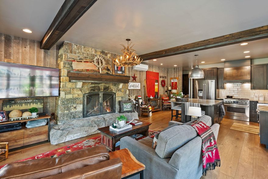 Designed for the luxury RV enthusiast, this custom-built home with a fully outfitted, heated shop is also the perfect second home or snowbird retreat. The efficient floorplan delivers high-end comfort with hand-selected white oak cabinetry, a chef's kitchen with quartzite countertops and built-ins, a wood-burning fireplace, and a spa-style tiled walk-in shower. The radiant in-floor heating throughout adds year-round warmth and efficiency. The shop is RV-ready with septic, 50-amp power, dedicated 30-amp lift circuits, water, and custom metal cabinetry. Exterior features include quarter-sawn cedar siding, steel accents, a premium tile roof, full landscaping with irrigation and lighting, plus a matching custom shed. Gated, fenced, and ready for future expansion.