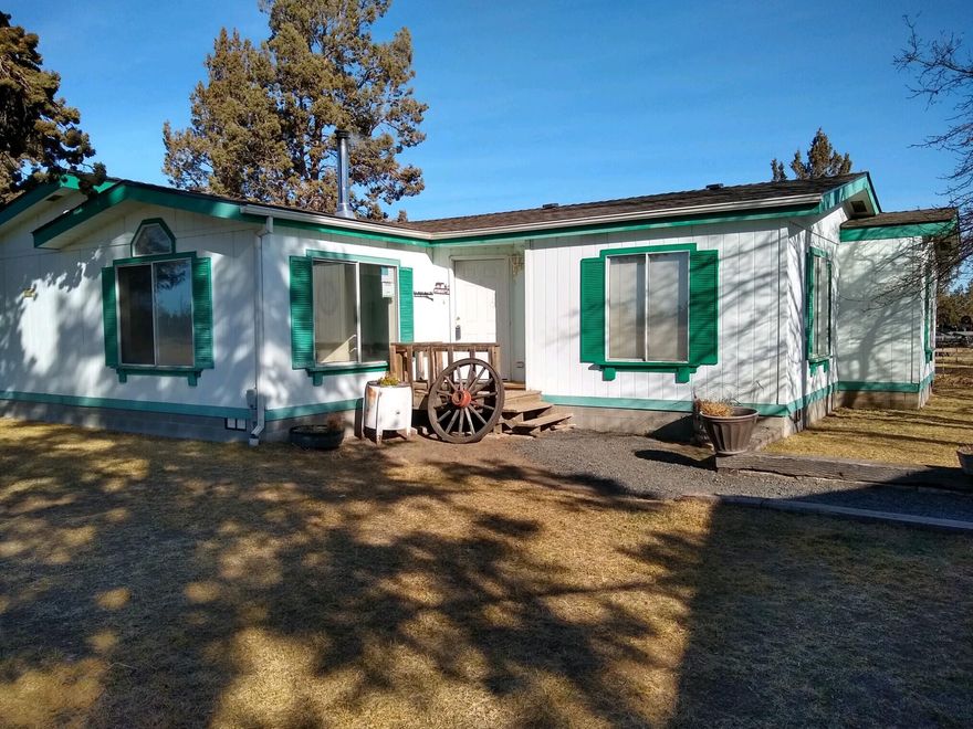 An Unique Opportunity to own this 3 bdrm, 2 bath home on 10 irrigated acres. Just 10 minutes to Costco and less than 3 minutes to your airplane at the Bend Airport! A Rare find, public lands on 2 sides with miles of riding trails for your horses or ATV's. Property includes 9 acres of COID irrigation rights, and includes all the needed equipment to irrigate  the field. The field is planted in 8 acres of Orchard grass hay, with yields up to 30 tons per year. Included with this property is a 30x30 shop with concrete floor, heated, and 220v. electricity. Also included are a 2 car garage, a 3 car garage, a 2 stall barn with a tack room and a corral. Plenty of room for the family, animals, and the ability to grow your own hay!
Call for an appointment to see this one of a kind property.