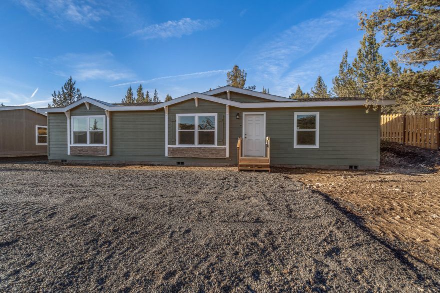 Brand new home w/ views of the ridge in the quiet Ochoco West subdivision. Open floorplan layout w/ spacious living area featuring tons of natural light. Kitchen features plenty of counter space, open eating area, dishwasher, oven, microwave, & tiled backsplash. Laundry room is adjacent to the kitchen. Oversized primary bedroom features carpet w/ large primary bathroom & walk in closet. All other bedrooms are large w/ carpet & share an additional large bathroom area. Homes feature upgraded exterior w/ decorative accents & plenty of room for parking. Just NW of Prineville. Enjoy all the inviting amenities Ochoco West has to offer; including a clubhouse, swimming pool, horse stables, rifle ranges, and fishing.