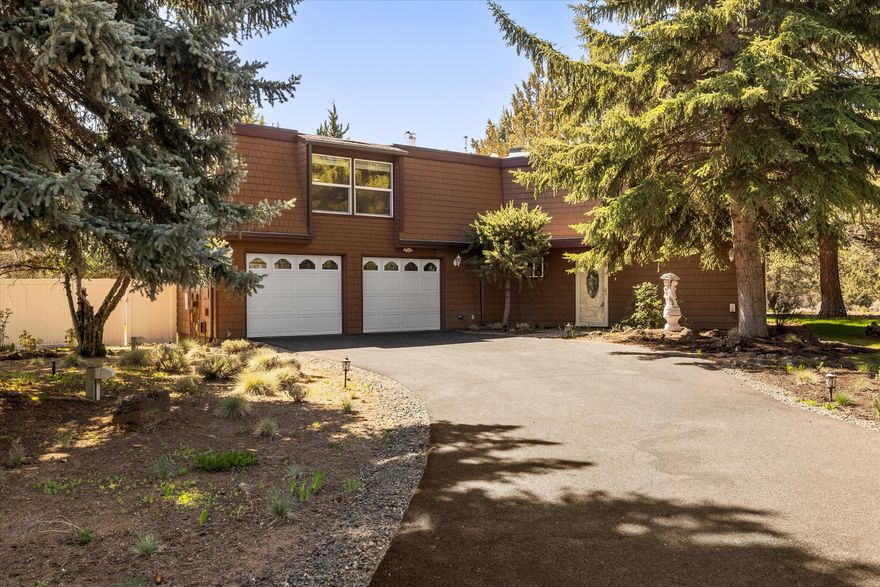 Motivated Seller!! Desirable King Forest Subdivision in SE Bend. This charming home sits on a spacious 1.12 acre corner lot surrounded by mature landscaping. The property features ample space for garden enthusiast, an additional workshop ideal for hobbyists, and the nightscaping lights surrounding the property creates a magical atmosphere after dark. Inside, you'll find 4 bedrooms plus a versatile bonus room, 2.5 bathrooms, and 2,220sqft of comfortable living space. Updated kitchen features quartz countertops, Hickory Cabinets, stainless steel appliances with a double oven and a convenient pantry. Recent updates include, Newer roof, updated ATT septic system, newer windows throughout, freshly paved driveway and updated bathrooms. Step outside and enjoy the lovely backyard which is fully fenced, landscaped with a small pond and oversized trex deck patio. Forced air heating and two pellet stoves adds comfort all year around. Schedule your showing today, this home is a must se