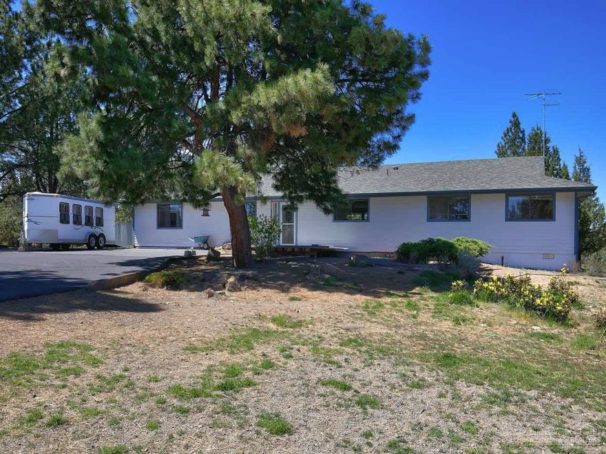 This is the dream 4-H property of all time! Single level home, Cascade mountain views, fenced and ready for horses. It has several shelters and separate dry lot enclosures, kennel areas and 5 ft. high fencing to keep deer out of the gardens and the area around the house. The home is open and bright with plenty of sunshine from every direction. You will love the incredible sunsets. Some TLC will make this amazing property your own. Located a short distance from Deschutes National Forest and government land.