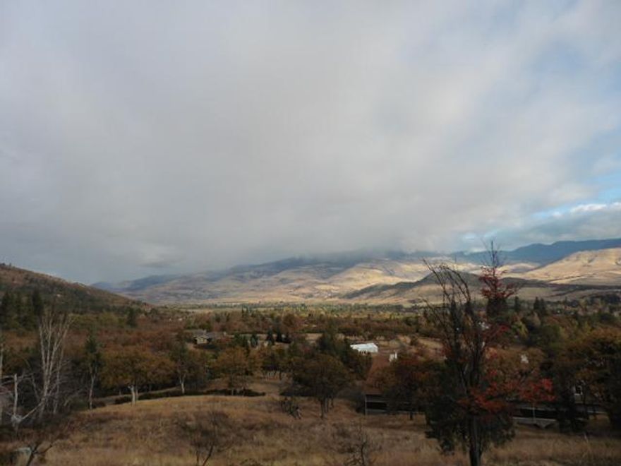 Fantastic acreage on the south end of Ashland offers pronominal mountain and valley views and easy access to freeway. Gated entry leads up a meandering driveway past a huge barn with many stalls and indoor arena. Continue up the drive to find a spectacular home with many amenities including a dream kitchen, wide open living room with fireplace, dining area with views and much more. 2 master suites, one on the upper level and the other down below and a possible 3rd bedroom that is was being used as a theater. Plenty of room for toys or vehicles in the 3 car detached garage. Property also includes a separate 1152 sq ft guest home. A truly amazing property!