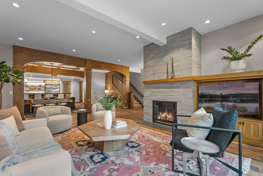 Discover this exquisite contemporary townhome in the heart of NorthWest Crossing. Boasting 2974 square feet, this residence offers both space and comfort. Inside you'll be greeted by an open and airy floor plan with lofty ceilings, complemented by rustic white oak hardwood floors. The kitchen is a chef's dream, featuring honed quartz countertops, a Thermador range and hood, a built-in refrigerator, and a pantry. The primary bedroom is a grand retreat, complete with a cozy sitting area, a private balcony, and a luxurious bath that includes a soaking tub, and a walk-in tile shower. The other 2 bedrooms have ensuite baths and direct access to a private balcony. For added versatility, a loft space can serve as a home office or workout area. Step outside to the patio, equipped with a built-in gas BBQ, making it the perfect spot for entertaining guests. The oversized 2-car garage is a storage enthusiast's dream, complete with a 220 EV car charger. Schedule a visit today to see this stunner.