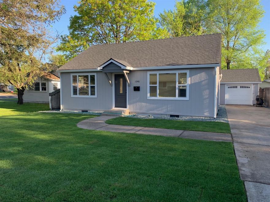 Breathtaking finish on this remodeled home. Tasteful colors and design throughout. Inside boasts new kitchen cabinets, new granite counters, new stainless appliance package, new tile floors, new paint, new flooring throughout. Bathroom is all new. New interior and exterior doors. New vinyl windows. Lots of can lights and fixtures inside. New roof, new siding, new paint. Must check it out dont let size deceive you. Very functional floor plan. New heating and air system installed by Icy Hot Heating and Air.