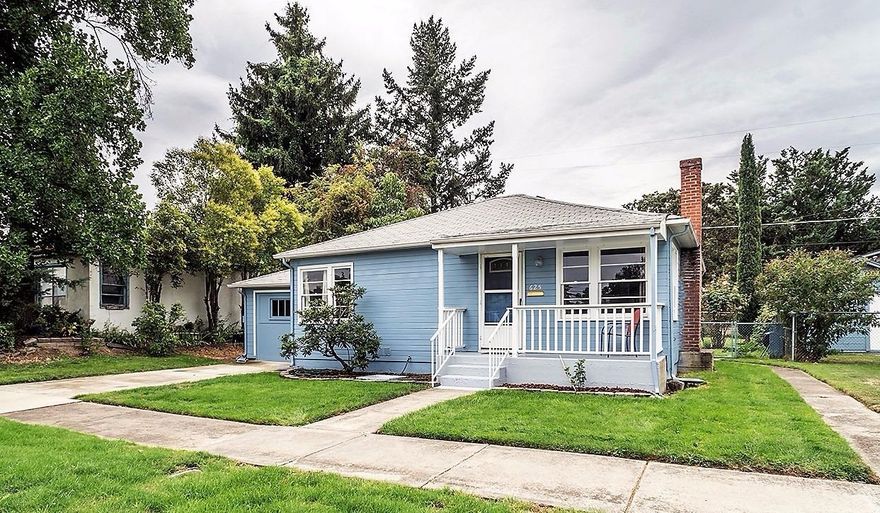 Adorable cottage with 2 bedrooms and a bonus room. Newly refinished hardwood floors, recently painted interior, lots of windows, fireplace. New sink, faucet, toilet and flooring in bath. New sink & faucet kitchen. Attached single car garage with alley access, covered patio, fenced backyard, automatic sprinklers, 3 rain water catchment barrels. Large utility room, bonus room perfect for office or hobby room. Forced air gas furnace. Conveniently located close to downtown and shopping.