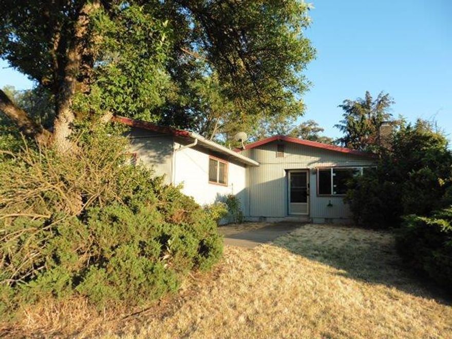 This 3 bedroom 2 bathroom home offers potential and a convenient location near services. Back bedroom and bathroom have suffered fire damage.