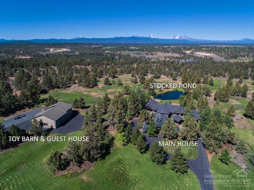Behind its gates, a spectacular 15.74 acre retreat stares directly at the glorious Cascade Mountains and is home to a gorgeous renovated main house with resort-like outdoor covered living space, full guest quarters, an unparalleled 5-bay RV toy barn sure to impress the most discerning buyer and a swimming pond stocked with bass. This gated and fully fenced property is located 8 minutes to downtown Bend and 13 miles from the Redmond airport.