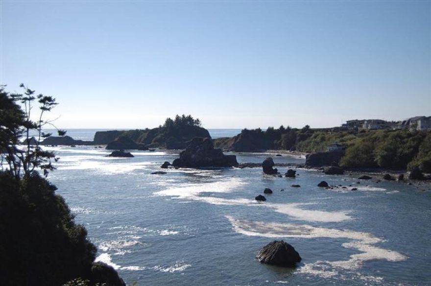 This spectacular property designed by Sam Vahey renowned builder/engineer is created with superior upgrades and attention to detail. From the Boffi Italian kitchen with huge center island made of wenge wood and with black satin granite to the Ipe wood decks and Port Orford cedar siding and ceilings. The roof is copper with copper downspouts. The railings are stainless steel with braided leather covers on the interior. The floors are distressed oak. The bathrooms are granite and teak with very high end waterworks fixtures. This house is an artistic marvel to match nature's marvel viewed from nearly every room. The view of the ocean cove is from 70 feet above your own private beach. You have to see to appreciate every detail. Watch the virtual tour.