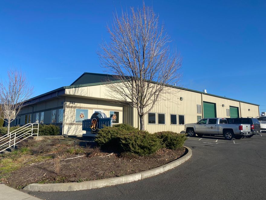 Approximately 8,575 SF industrial building on 0.55 acres, built in 2003.  Just over 3,000 SF is built out as quality office space with an open assembly/work area.  The office and work area are fully climate controlled.  There is an additional approximately 1,350 SF of mezzanine storage accessed by stairs in the warehouse area (not included in the total building square footage).  The approximately 4,200 SF warehouse space is heated and insulated with high ceilings.  The building is steel frame construction with metal siding and a metal roof.  Both the exterior and interior of the building are in good condition.  The property is located within the Northwest Medford Industrial Park.  It is zoned General Industrial (I-G), and has a good sized fenced/gated/paved yard behind the building.  10 HP air compressor with air lines throughout the warehouse area.  There is an existing paint booth in the building that is not included in the sale.
