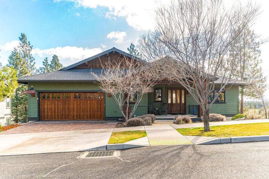 This stunning home in Shevlin Ridge is flooded with natural light at every turn. An open great room plan graced with lofty 10' ceilings faces panoramic easterly views and connects to a full deck perfect for entertaining and relaxing. The well appointed kitchen is anchored by a large island with breakfast bar, gas range and generous pantry.  Main level primary suite includes a gas fireplace and jetted tub taking full advantage of exceptional long range views. Lower level includes a truly generous bonus room with wet bar, wood burning stove and extensive storage as well as access to view facing paver patio. Also downstairs, a junior suite with attached bath and walk-in closet, plus additional bedroom and bath. Large laundry room connects to a four car garage with partial radiant floor heating, raised area perfect for workout or workshop and plenty of room for gear of every type. Exceptionally located on a cu-de-sac with easy access to everything that Bend's west side has to offer!