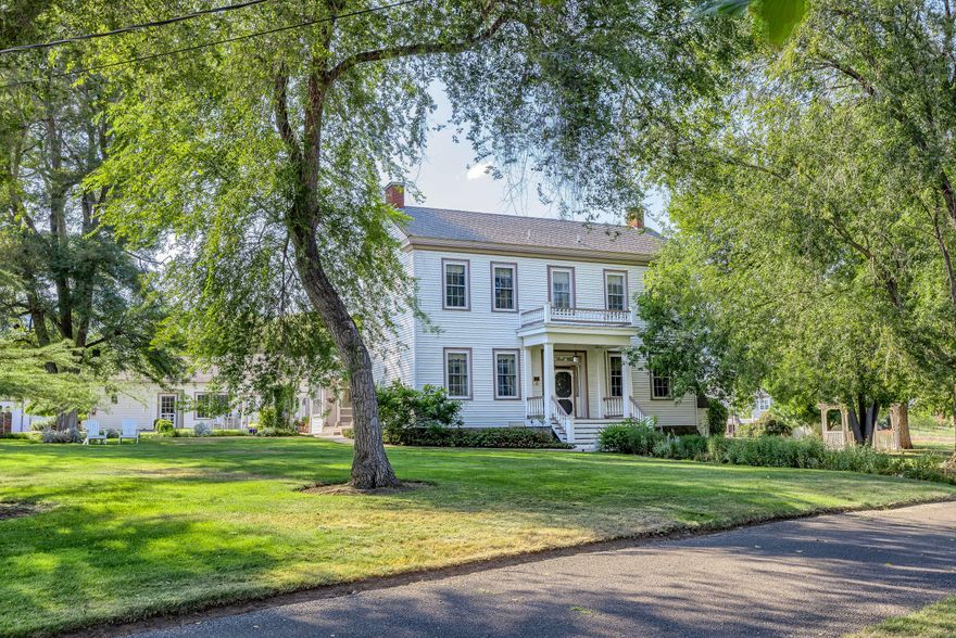 Own a local gem & prepare to fall in love w/this beautiful romantic estate!  Whether you want to operate a B&B, wedding venue, need multi-family living, or simply have room to breathe, this idyllic setting invites you in.  This Rogue Valley jewel offers original ornamentation & distinctive décor, designer decorated bdrms, 6 fireplaces, butler's pantry, jetted & clawfoot tubs, library & parlor.  Kitchen features Vulcan Range/Oven, Subzero fridge, prep sink.  Over 2 acres lushly landscaped w/secret garden, BBQ nook & Koi pond.  Multiple outdoor seating areas. Detached carriage house offers its own gourmet kitchen: Viking range/oven, Subzero fridge & island w/prep sink & pantry. Just minutes away from Jacksonville.  Elegant furnishings included for a turn-key sale! Commercial & domestic septic systems.  2 operating wells (one artesian) + holding tanks.  Detached 4-car garage.  Great opportunities to explore here! Adjacent 2.5 acres can be purchased separately.