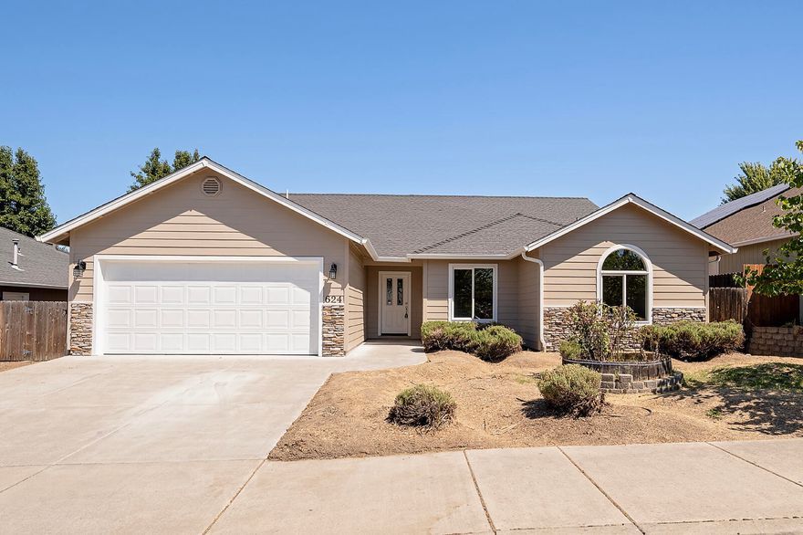 Welcome to this spacious and updated 4-bedroom, 2-bathroom home in the sought-after Barton Hills subdivision of Eagle Point. Built in 2007, this single-level gem sits on a generous lot with a large backyard—perfect for your personal touch or dream landscaping project. Step inside to an open, light-filled layout featuring vaulted ceilings, a split floorplan for added privacy, and a spacious living area with gas fireplace ideal for relaxing or entertaining. The versatile fourth bedroom offers the perfect opportunity for a home office or creative space. The large primary suite includes a walk-in closet, dual vanity, and a spacious bathroom retreat. You'll also enjoy generously sized secondary bedrooms, a dedicated laundry room, and an abundance of natural light throughout. Recent upgrades include BRAND NEW exterior paint, HVAC system, and a new motorized garage door opener—giving you peace of mind and modern comfort from day one! Call for a tour today!