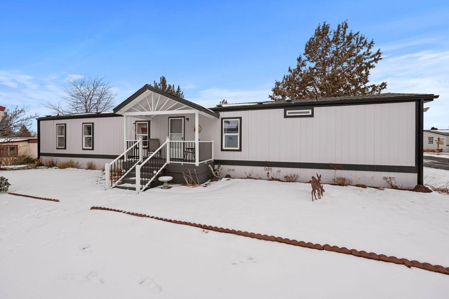 Located in a 55+ well maintained community w/access to public lands. Home is turn-key with new roof, paint, & carpet. Well sized living area boasts an abundance of natural light & windows w/separate dining & kitchen areas. Kitchen has plenty of cabinetry storage & counter space for prep, with all appliances included. Dining area located adjacent to the kitchen. Spacious primary bedroom ftrs walk-in closet & primary bath w/step-in shower. Secondary bedroom with access to its own full bath featuring shower/tub combo. Washer/Dryer area w/pantry style shelving above it is off the kitchen. Outside you'll find a covered carport parking w/enclosed storage/shop space. There is free community RV/toy parking spaces as well. Sprinklers in front, covered front & rear porches w/room for sitting/entertaining. Don't miss this one, it won't last!