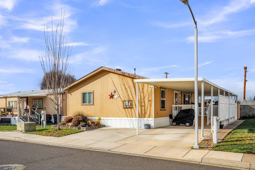 Newer home in the highly sought after San George Estates neighborhood. Beautiful and functional, this 3 bed, 2 bathroom split floor plan boasts vaulted ceilings, laminate flooring, newer upgrades and a Harmen pellet stove. Step inside to find a spacious kitchen with abundant storage space, Insta-hot tap on kitchen sink, large pantry and utility room with access to the backyard. The master bedroom has its own private bathroom with dual sinky vanity, a walk-in shower and walk-in closet. Outside there is a large covered deck with ramp access and 2 storage sheds with power. The park features a clubhouse, pool and seasonal events.