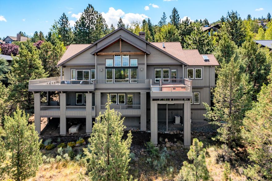 Your high desert sanctuary awaits. This spectacular custom home sits atop Awbrey Butte offering panoramic views of the Cascade Mountain range. Enjoy the alpenglow sunsets over the Cascades, or stargaze in the hot tub in the evening, and relax into this serene, peaceful setting. Over 3,950 square feet of luxurious space featuring updated gourmet kitchen with huge island, eating bar, and top-of-the-line stainless steel appliances. Wake up to mountain views in your luxurious main level primary suite. Lower level features a 2nd primary guest suite, family room with fireplace, 2 additional bedrooms, plus flex room. Oversize triple car garage and heated driveway. Embrace the friendly community culture and all the Central Oregon lifestyle has to offer just outside your door. Within minutes to quality schools, charming downtown, shopping, microbreweries, river trails, golf, and Mt Bachelor ski resort. This property is immaculate, well-cared for, and ready for new owners. Welcome home!