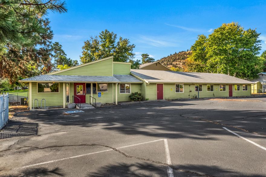 Single story commercial building with excellent parking and exposure located near St Charles Medical Center and within the Opportunity Zone.  Zoned Residential Medium Density, with Medical District Overlay, this property affords abundant end-use and expansion options.  Included is a full set of approved/engineered construction drawings for a triplex along with conceptual drawings for a commercial/office remodel.