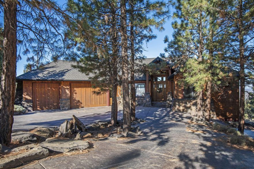 Walk into this Northwest Lodge style home to stunning unobstructed Cascade Mountain views with amazing privacy from your neighbors. Great room concept, vaulted ceilings, fireplace, hardwood and stone floors, wood wrapped windows, artwork quality painting throughout. The primary bedroom is on the main floor with fireplace, heated floors in en-suite and under-counter lighting. Downstairs includes 2-bedroom en-suite with a full kitchen, family room space and wine cellar.  This home has 2 offices, one on the main floor and a large office off the garage. Come see this authentic mountain home.