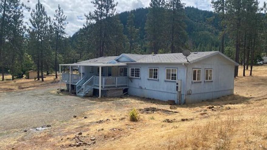 Inviting home on 11.57 acres with 3 bedrooms, 2 full bathrooms and an open-concept layout with 1680sqft designed for comfortable living and easy entertaining.  Spacious kitchen offers abundant counter space and cabinetry and a big kitchen island.  Primary bedroom features large ensuite bathroom with walk-in shower and a separate soaking tub.  The location is quiet and peaceful with room to add a garage/shop, swimming pool, or just lots of space to explore.