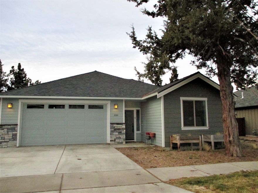 Come See, Come Buy! Top quality construction and finish products in this 1,655 square foot single level home. The vaulted great room boasts a cozy woodstove and a wall of windows looking out to the fenced back yard. Granite countertops, quiet close drawers and a work island are just a few of the highlights in the kitchen. This owner's bedroom and bath includes a French door to the patio, a six foot dual headed tiled shower and two sinks. Two additional guest rooms and bath, with nice separation, located on the other side of the living area. An additional fenced side yard provides room for your RV or boat. All of this tucked into NE Bend. 2015 construction with an easy care, natural scape.