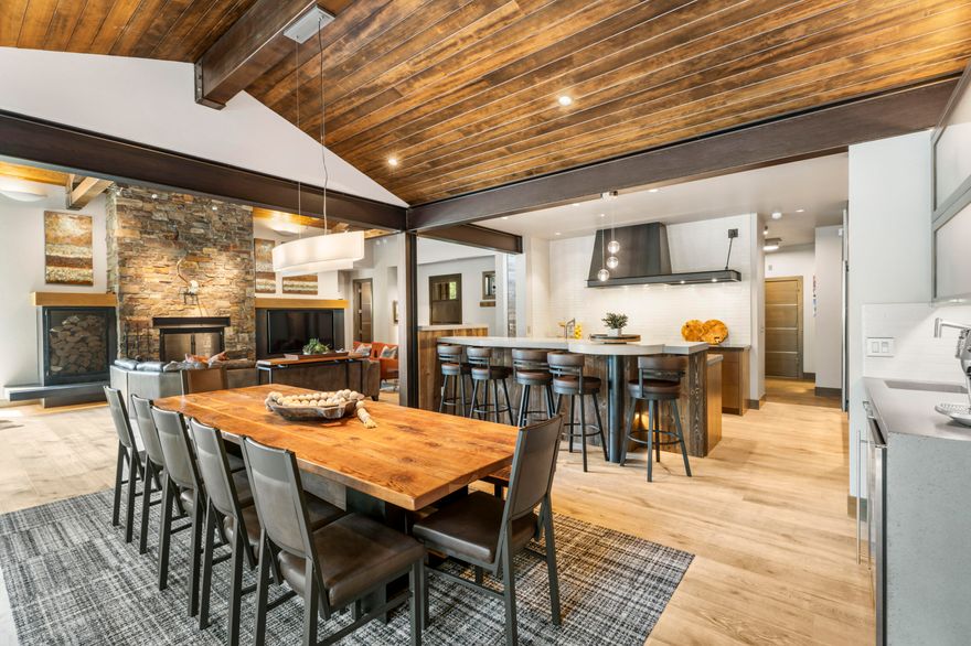 Exquisite custom mountain-modern home in Caldera! The expansive great room showcases a vaulted wood ceiling & full masonry wood-burning fireplace w/ convenient exterior wood box access. The gourmet kitchen is a chef's dream featuring high-end appliances, a spacious pantry & striking custom steel trim elements including Sub Zero panels & hood. Additional luxury touches include hand-routed steel-trimmed doors, custom cabinetry & lighting throughout. The main level offers radiant floor heat, a spa-like primary suite with steam shower, and even exterior shower walls w/ radiant heat. Thoughtful details continue w/ central vac, oversized heated 2-car garage w/ golf cart bay plus an additional heated 1-car garage. Enjoy exceptional outdoor living on the expansive patio w/ a fountain, built-in BBQ, outdoor heater & hot tub. Radiant ice-melt has been added from the slider to the hot tub & along the pathway to the garbage area. A true showcase of quality craftsmanship & custom design.