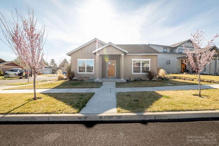 Convenient single-level Craftsman by award-winning builder Woodhill Homes features a welcoming foyer leading to bedrooms, hall bath & nicely appointed owner's suite w/walk-in closet. Entry hall continues to large great room w/vaulted ceilings, gas fireplace & beautiful kitchen/dining area, boasting slab counters, stainless appliances & tile backsplash. Side-entry garage on a corner lot gives this home lovely curb appeal w/additional privacy. Covered front porch & large patio offers additional outdoor space.