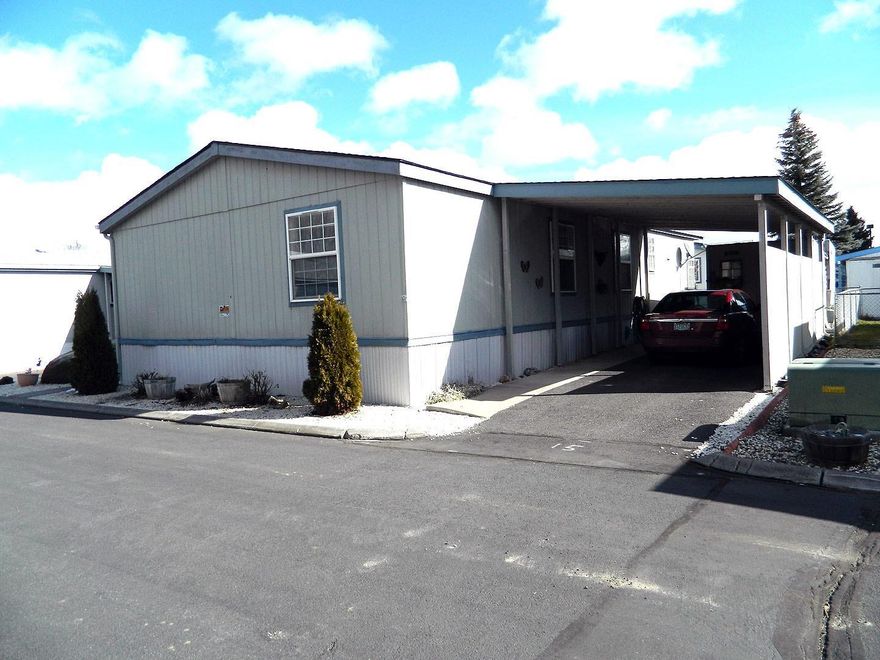 This is a great home in a senior mobile home park. It is a very clean 3 bedroom 2 bath home with a separate TV room or den. The furniture is included in the sale of the home. There is a garden tub and separate shower in the master bath. Enjoy your time out on the small deck in the back yard. There are 2 storage sheds and a full carport to park under.