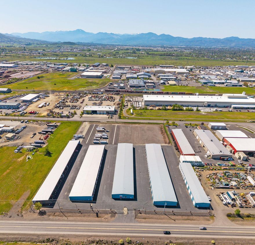 Investing in Storage: Why Big Boy Maxi Storage is a Smart Choice for Savvy Investors. ''Big Boy'' is a well established flagship storage facility located just north of Medford in a High exposure industrial area of White City with close proximity to major arterials. Great rental history with year over year increasing profits. There is 50,232 sq. ft. of enclosed storage built in 2005. These 62 enclosed units have various sizes from 12' x 20' up to 24' x 65'. There's an additional 35,316 sq. ft. of canopy covered parking with 73 spaces ranging in size from 12' x 25' up to 12' x 65'. Occupancy at 99%. Recent 2.92-acre expansion to this complex includes 90 additional outside spaces ranging in size from 15'x35' up to 15'x46', along with expansion area #2 offering 36 15'x35' parking spaces. Wash bay, RV dump station and a 480 sq. ft. office space. This fenced 7.40-acre complex has paved alleys & lighted areas, 24-Hour access with coded entry, security cameras w/optional off-site monitoring.