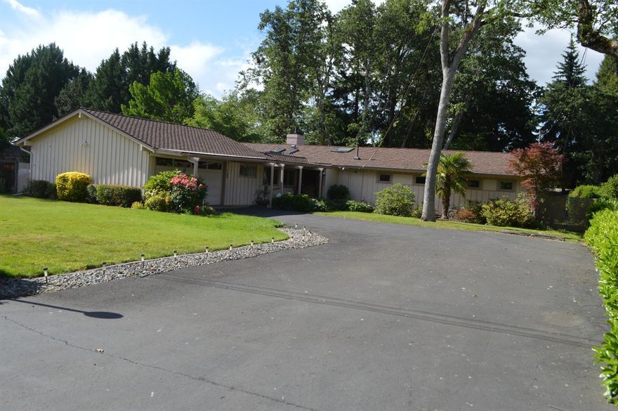 Mid-Century modern home w/open beam vaulted ceilings. Floor to ceiling windows to take in the park like grounds of this private .39 acre lot w/ city services & private well for irrigation for landscaping around the yards w/ timed sprinklers, beautiful decks off living, master suite & great side patio off family rm & 3rd bath. Newer updated kitchen, gas log fireplace & built in bookcases in living room & family room, separate den/office. Private area next to 3rd bdrm & bath. Many skylights, newer roof, heating or lg. 2 car garage w/ workshop area & good size wood shed in back of property. Built in buffet in formal dining rm, lg. family rm w/built in wet bar, cabinet, gas cooking, ref., steam washer & dryer included. Master w/walk in closet, dbl sinks, designer cabinets, tile floors & door to deck off Master. Built in 1957 & designed by Fred Persian, Architect from San Francisco, influenced by Floyd Wright. Lot's of updates, this cool looking home sits in a great, quiet, dead end stree