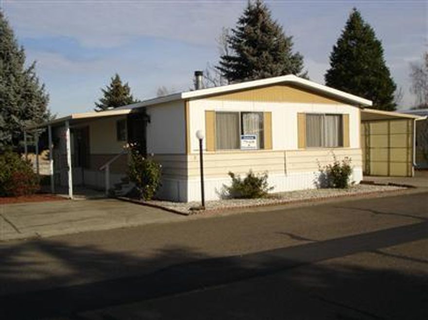 24x52 Double wide home in a quiet family park. Space rent is $337, which includes water, sewer, garbage pick-up, play ground, pool & club house. Home has 2 large storage sheds & two covered patios.