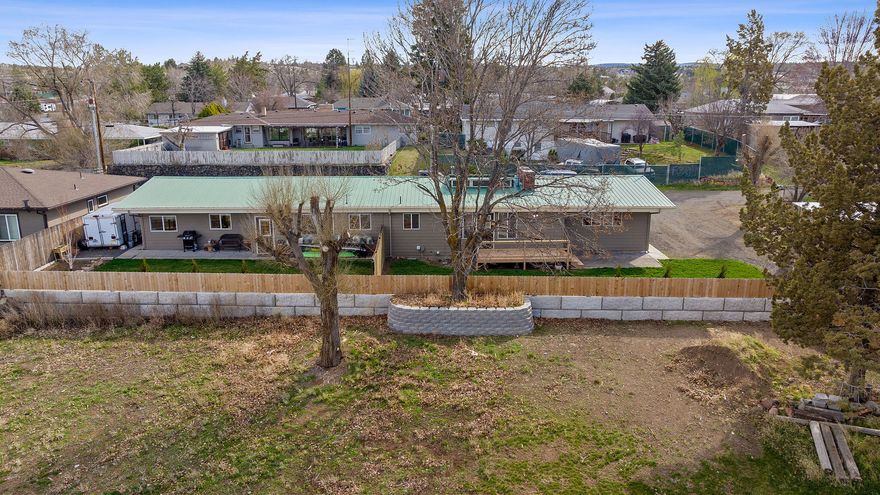 Don't miss this fantastic investment opportunity! This well-maintained duplex offers stunning sunset views, with a picturesque backdrop of the mountains and historic train trestle right out front. Each unit features spacious living, updated finishes, and a bright, open layout. Larger side is a 3 bedroom 1 bath the other side is a 2 bedroom 1 bath. Outside, enjoy a fully fenced yard, a storage shed, and plenty of off-street parking. The property sits on a generous lot with room to roam, and is conveniently located near schools, parks, and downtown amenities. Whether you're looking to live in one side and rent the other or expand your investment portfolio, this property checks all the boxes!
This lot is .30 buyer to due diligence with the city on an ADU or building another home or duplex.