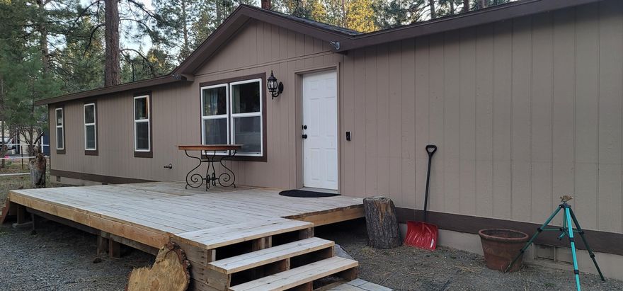 Large home sits back from paved road. Heat pump for AC master bedroom separation - newer carpet and paint -