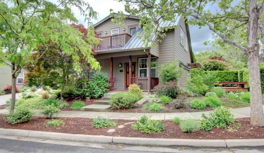 Lovely Contemporary Two-Story in Clay Creek Gardens! Enjoy one of Ashland's most sought after neighborhoods in this beautifully built and maintained Suncrest Homes creation. You'll love the open concept living, dining and kitchen with elegant hardwood, soothing designer colors, gas fireplace, custom-quality light fixtures, well-appointed kitchen with granite island work space, painted cabinetry, nice pantry and wonderful storage. This home offers two large bedrooms, one with a built-in Murphy bed, main-level office or guest space, large sunny deck, private backyard with arbor, hot-tub and beautiful, mature landscaping that's easy to maintain. Energy conscious buyers will appreciate the solar array and quality metal roofing that offset much of the electrical bill! Clay Creek Gardens includes lovely open spaces, community garden plots, easy access to schools, shopping and some of Ashland's finest amenities. This charmer is what you've been looking for!