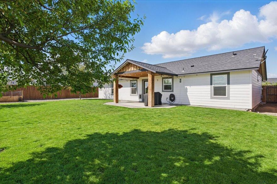 Welcome to your dream retreat at 322 Bluegrass Drive, an oasis nestled on a spacious lot in one of Central Oregon's most charming neighborhoods. Built in 2019, this thoughtfully designed 3-bedroom, 2-bathroom home offers the perfect blend of comfort, style, and tranquility. Step inside to discover open-concept living with upgraded finishes throughout, ideal for both relaxing and entertaining. The oversized primary suite features a luxurious en-suite bathroom and a spacious walk-in closet, creating a peaceful sanctuary within the home. Out back, enjoy unobstructed views from your beautifully landscaped patio and yard—perfect for morning coffee, sunset dinners, or stargazing under the clear Oregon skies. Brand new garden bed included. Located just 20 minutes from Redmond and 7 minutes from Lake Billy Chinook Marina, you'll enjoy easy access to outdoor adventures, dining, and amenities—all while savoring the serenity of this private escape.