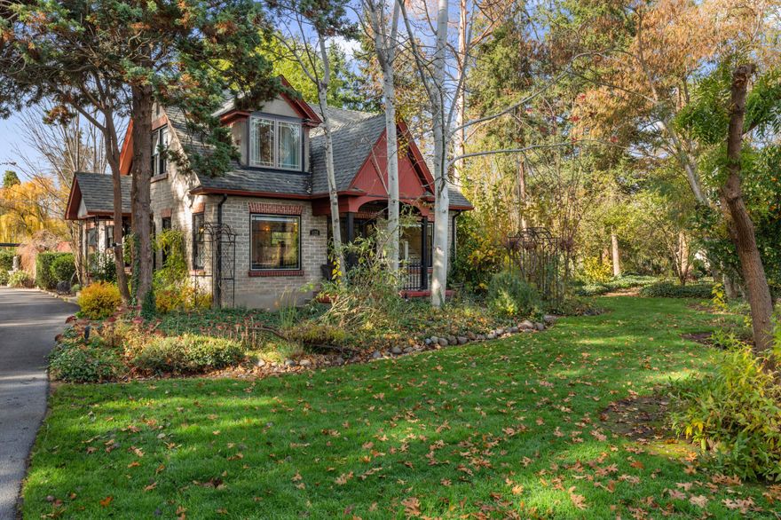 Enchanting and charming! Located just outside Jacksonville, w/ beautifully restored historic architecture, this 3bed/2bath home is like out of a storybook! Built in 1926, yet restored & updated to modern expectations, this home sits on 1.61acres & is a MASTER GARDENER'S DREAM with color year-round and fruit trees, redwoods, +more. Outdoor features inc. a courtyard, ample gardening space,  32x40 garage/barn for any vehicle - inc 14' door, shop w/ guesthouse above bringing total square footage to 3,056 sqft! Whether it's time to cozy up next to the fireplace or enjoy a meal in the dining or eat-in kitchen, this house feels like home! Featuring beautiful hardwood flooring throughout, a well-appointed kitchen, granite countertops, updated appliances, & plenty of space for everyone! The home has many bonus areas, inc. an office, a designated laundry room, & well-thought-out walk-in closets. Also, an adorable 1bed/1bath unit that would be excellent for a potential Airbnb!