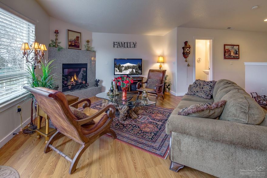 Enjoy reverse living with Cascade Mountain Views overlooking the park & pond. Main level is open & bright w/tons of windows, vaulted ceiling & private deck. Spacious kitchen with bar seating, stainless appliances, Corian counters & tile floor. Great room features a corner fireplace & wood laminate flooring. Master Suite has a 2nd deck, lg bath w/walk in closet & jetted tub. Immaculately cared for, this home is move in ready & a must see! HOA cares for entire exterior!