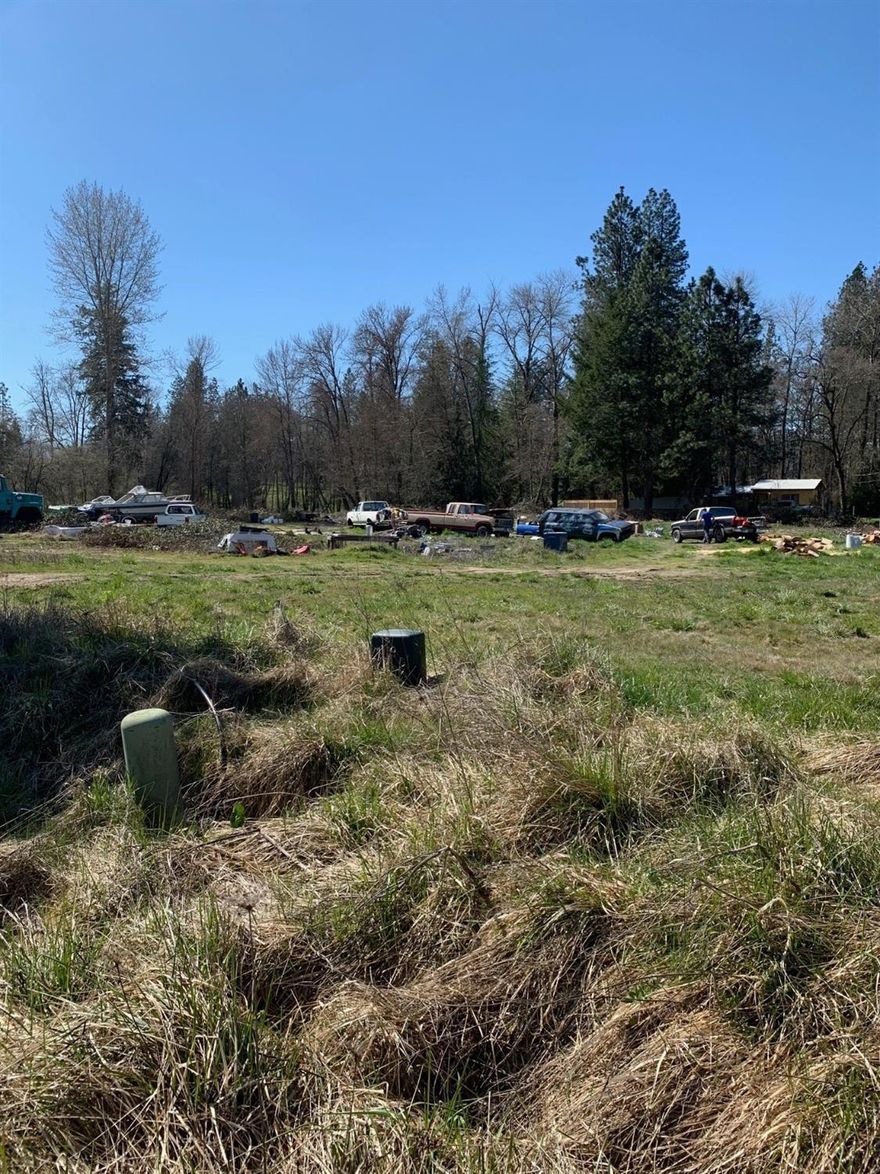 Nice sub-division in District 7 schools. .93 level acres in a nice sub division. 14 gpm well per owner, septic approval (sand filter), with electricity, natural gas, telephone & cable at the street. Irrigated by GPID. Lot is located on a cul-de-sac & is only 2 miles from Grants Pass. Close to shopping & all county/city services. Build your dream home HERE!