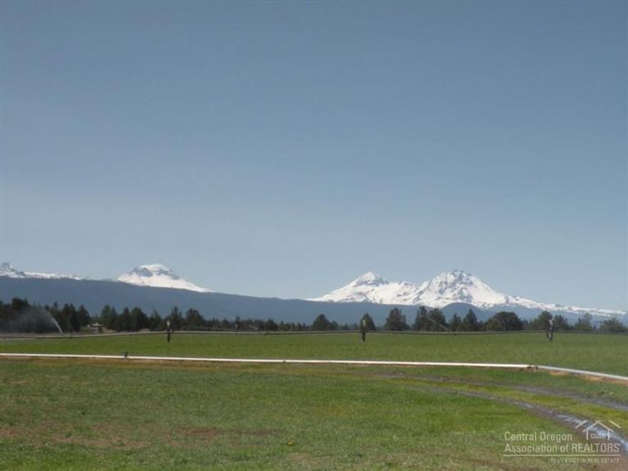 A rare opportunity to own a special 100 acre Tumalo property. This Cascade Mtn view property consists of 3 legal lots: a vacant 40 acre parcel, a vacant 20 acre parcel, & a 40 acre parcel with a 3 bedroom 2 bath manufactured home & a large shop w/ guest quarters. Each parcel has irrigation water rights & each offers unique terrain features. The shop provides a lot of room for your farm equipment, toys & hobbies while the home offers a comfortable place to live while you build your dream home.