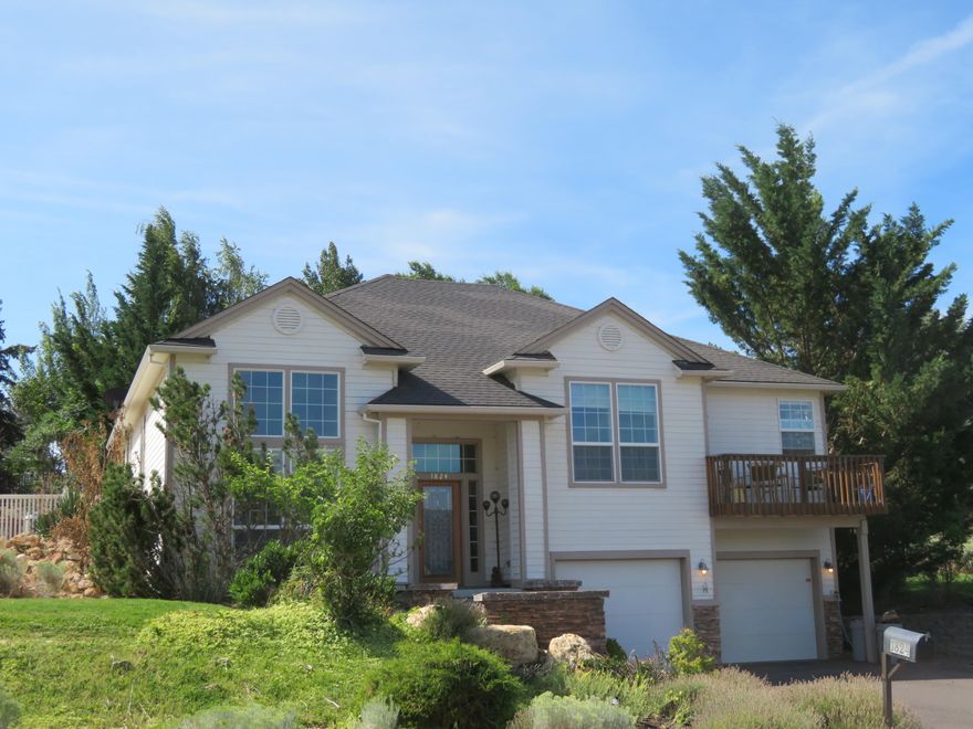 Crown Ridge home on .35 acre with mountain views to the sunset. 2581 sq ft includes-four bedrooms, two baths. Main suite with soaking tub, shower, walk in closet and lovely deck for morning coffee with a view. Family room off kitchen and patio to huge level backyard with water feature. All surrounded with vinyl fence and lots of tees for privacy. Dining and living room, oversized two car garage with tons of storage. Lots of off street parking with room for your 34 foot RV and company. Swim spa, sunset awning and all appliances included. Some carpet, but mostly wood/laminate. Work near campus? walk to work!