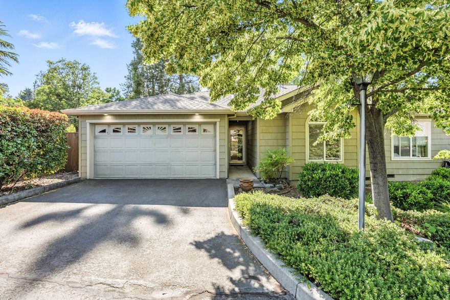 Sought after single level Birchwood Townhome. Designed for easy access and comfortable living, this two-bedroom, two-bathroom home with approx. 1272 SF was built in 2000. Open and bright floor plan, living room has a wall of windows, coffered ceiling and a gas fireplace. Dining room has access to a private back patio for outdoor enjoyment. This is an end unit with open space on one side. Great location, convenient to shopping, YMCA, banks and bus line. HOA fees include front yard and common area landscape maintenance, also the street lamps and private lane. Roofs, painting and maintenance of structure and patio area are the owner's responsibility. Attached finished garage. This is a lovely home awaiting the next owner's personal touches.