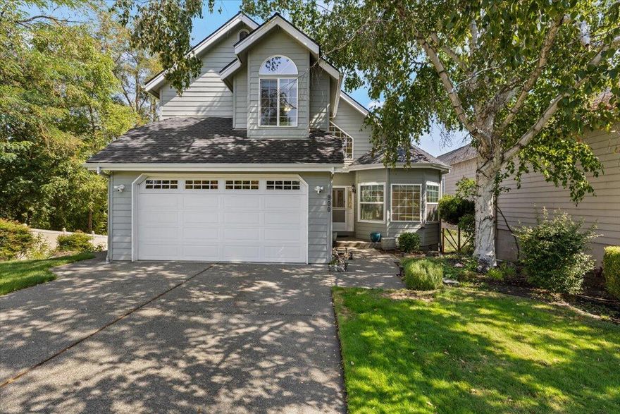 Welcome to this grand home in the highly desirable Rogue Terrace Estates, offering 3 bedrooms, 3 full baths, plus a spacious 525 sq. ft. bonus room. The main level is filled with natural light and sweeping river views, showcasing an open floor plan with a living room, dining area, kitchen, and family room with a cozy gas fireplace. A full guest bath, laundry area, and attached 2-car garage complete this level. Upstairs, you'll find a generous primary suite with a walk-in closet, two guest bedrooms, an additional full bath, and abundant storage. The lower-level bonus room offers endless possibilities—ideal for an additional bedroom, entertainment space, home office, or studio. All three levels feature decks that invite you to relax and take in the breathtaking views of the Rogue River and surrounding mountains, along with the soothing sounds of the water.