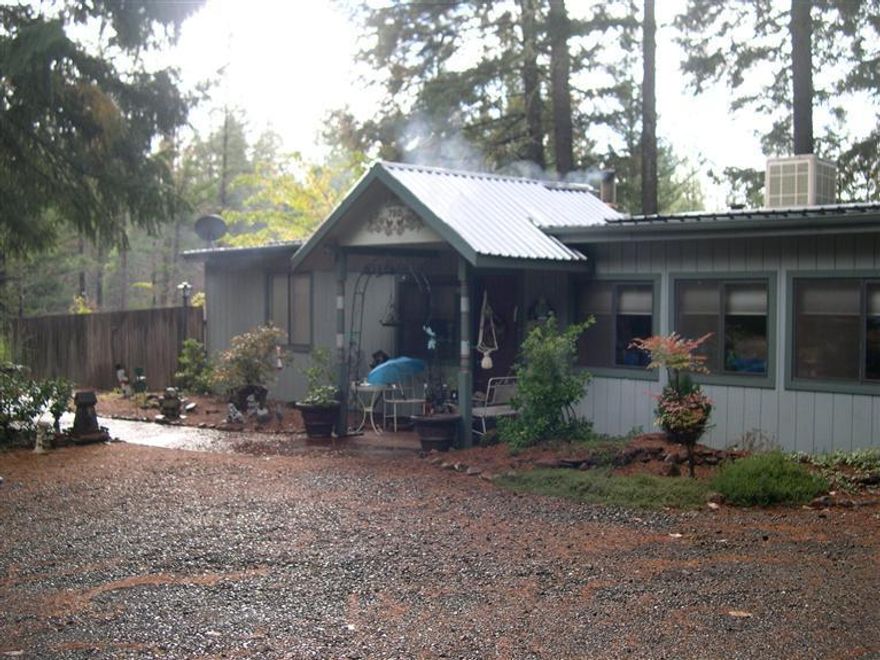 2 SW mobiles on one tax lot. One is a hardship. Either mobile can be hardship.If one mobile is not used as a hardship it needs to be removed. Entire property is fenced. Nicely landscaped. Inground sprinklers and drip irrigation. Mobiles use same well and septic. Metal roofs on both. Workshop. Mobile #1 is a 1962 Premier 16x44 704 sq. ft. with additions. Wood siding, heat is electric and wood stove, patio, dbl paned windows, walkin closet, R/O is propane. Mobile #2 is a 1982 Hillcrest 14x60 840 sq. ft. Metal siding, heat is electric forced air, window AC, garden area, deck, R/O is electric with convection, microwave. Check with planning regarding hardship requirements.
