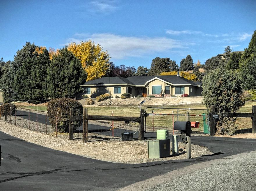 Beautiful Home in desirable location! Come see this well cared for 3 bedroom 2 bath home on 2.37 Acres! This home features an Open Floor Plan, Tile floors in kitchen & bathrooms, Bay Window, Indirect lighting, Walk-in Shower, Master bedroom features a walk in closet, Master bath with double sinks. All beautifully landscaped including underground sprinkler system. Apple & Pear trees, fenced with cyclone fencing. Two extra garages with cement floor, one with 200 amp service and heated, with extra bonus room upstairs.