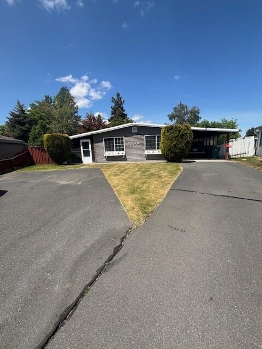 Updated home in Suburbs Cul-de-sac with private park like yard!  This open floor plan featuring 3 bedrooms, 2 baths, Living room, family room, den/office area, dining room, open kitchen with center island, spacious laundry room with linen closet and cabinets for extra storage.  Home has been updated by current owner with solid surface counter tops in the kitchen, Laminate flooring throughout, New heat pump & A/C, custom window coverings and paint. Outside enjoy the screened in covered patio, manicured yard with workshop, green house with power and water, storage shed and several trees giving shade.  There is a 3-car carport, uncovered paved parking as well as area for additional parking or RV parking on the other side of home.