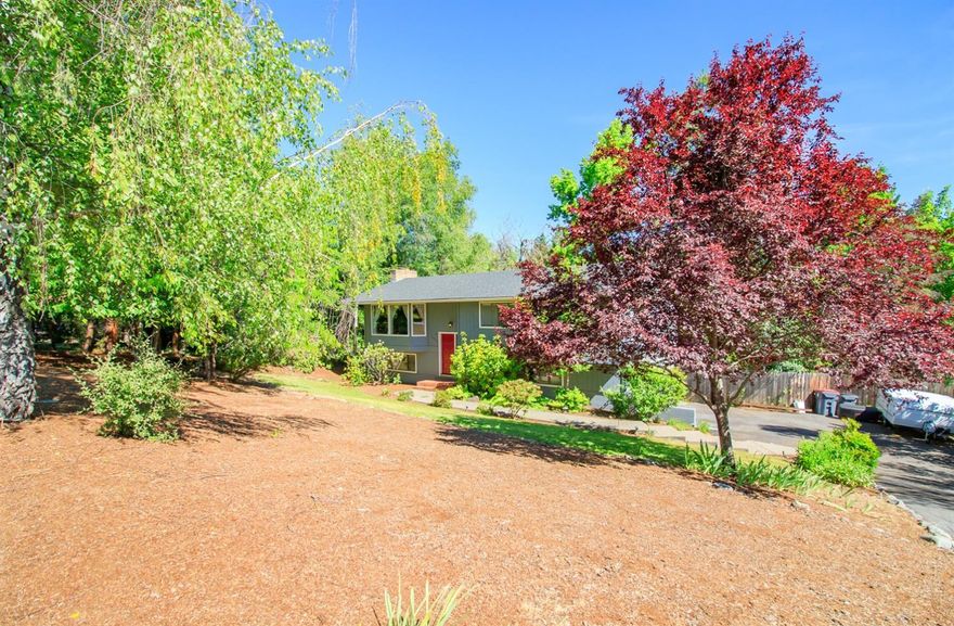 Situated on a rare half-acre lot nestled in the hills of East Medford, this beautiful home features a deck off the kitchen and dining area overlooking an inviting in-ground pool with a hot tub under a wooden gazebo. All the bedrooms are located on the main floor with a daylight basement below which could be perfect for a office, billiard or media room. The fully fenced backyard and mature landscaping ensures privacy and ample opportunity to entertain guests and children! The over-sized two car garage leaves plenty of space for a work area or storage.