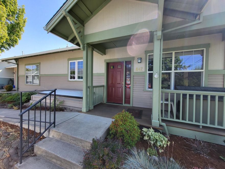 Fabulous views from this upper level condo with attached one car garage.  Looks like a single family home but is one of the over/under condominiums.  Wood floors, vaulted ceiling in living room, gas fireplace, large balcony with retractable awning and covered front porch entry.  Loads of storage throughout, large laundry room and easy access to the garage.  Large main bedrooms and a smaller bedroom which makes a great office or den.  Primary bedroom suite with walk-in closet, low step in shower, and large windows provide a great view. Great location close to the clubhouse and community center and activities.  Located in a 55+ community with association dues which maintain the beautiful landscaping, common areas, building exterior & roof, and much more.  Experience easy living in this lovely condominium home and enjoy the activities offered in the Mountain Meadows Community.