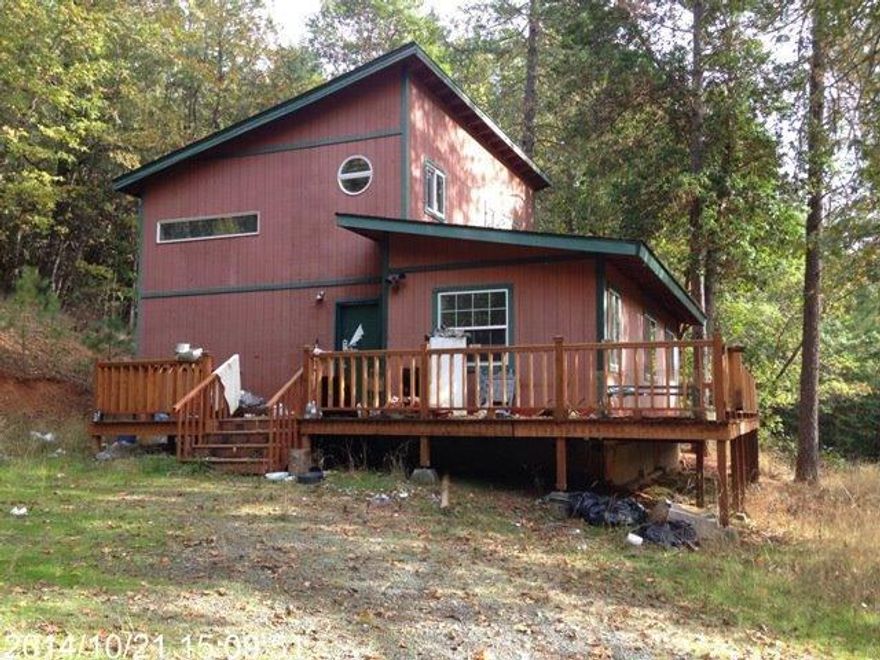 Property is being sold via online auction 11/22/14. Seller is not bound by this listing price and has the right to accept or reject any offer. Great country home with 15+ acres. House has an unfinished 2nd story with approx 540sf that includes bedroom and bath. Open floor plan, lots of potential. Home is sold as is and probably won't qualify for loan because of the unfinished portion of house. Large metal shop, barn, 2nd shop/shed. Partially fenced. Easy access to freeway but not impacted by noise, land is sloping and nicely wooded.