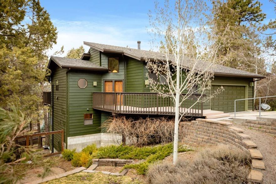 Warm and appealing Northwest Contemporary design with cedar siding, in beautiful wooded setting in Lynnewood. This tri-level home features metal shingle roof, and double door entry, that leads into great room with vaulted ponderosa pine tongue & groove ceilings, a brand new pellet stove and door out to nice deck for entertaining plus a 1/2 bath on main floor. Efficient Oak kitchen, 5 burner gas cook top and wall oven, plenty of cabinets and eating bar. Upstairs features a loft/TV room, and down stairs there are 2 guest rooms, guest bath plus a roomy en-suit bedroom with full bath and a slider out to a private deck. Gas F/A heat, gas tankless water heater. All on .36 acre, 2 car garage with sink, work bench, & built in storage, fenced back yard with auto sprinklers.